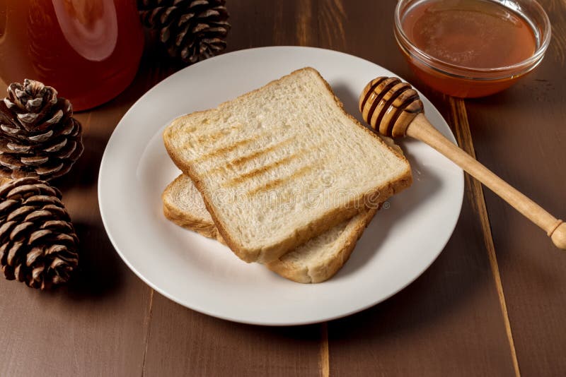 Honey with Stick Pouring Over Bread Stock Image Image of bowl