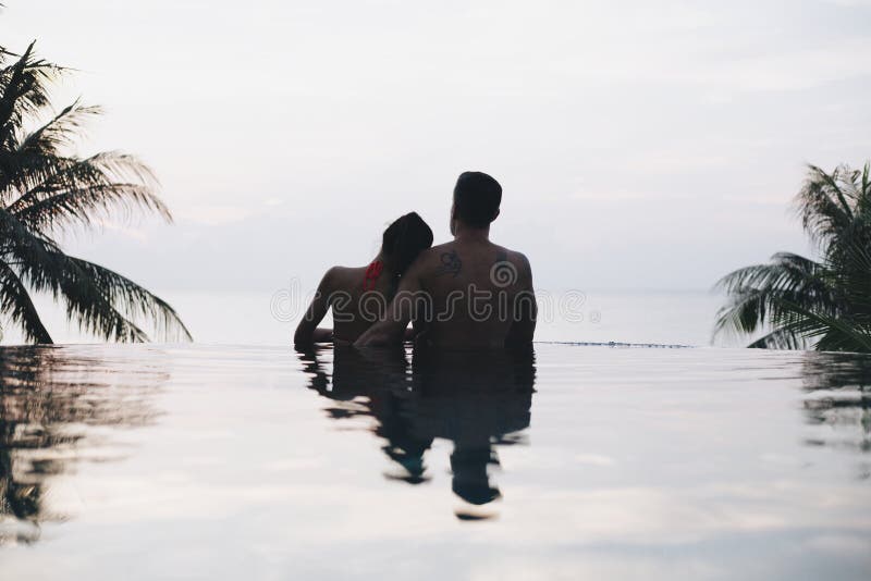 Honeymooners watching the sunset together royalty free stock image Honeymooners watching the sunset together royalty free stock image