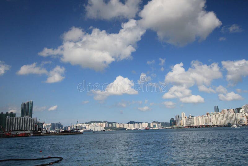 Sky, skyline, cloud, waterway, daytime, city, horizon, sea, water, cityscape, river, metropolitan, area, cumulus, metropolis, calm