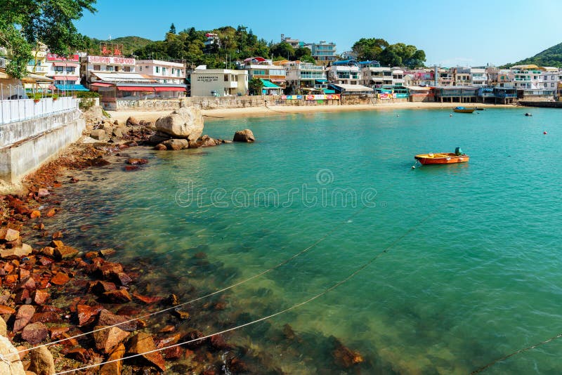 Yung Shue Wan village on Lamma Island, Hong Kong. View from ferry pier. Sunny townscape