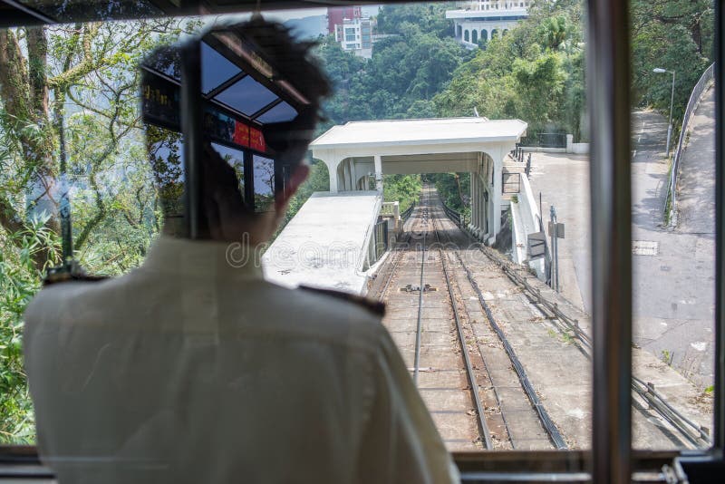 Rail Conductor on the Victoria Peak Tram Cable Car Editorial Image