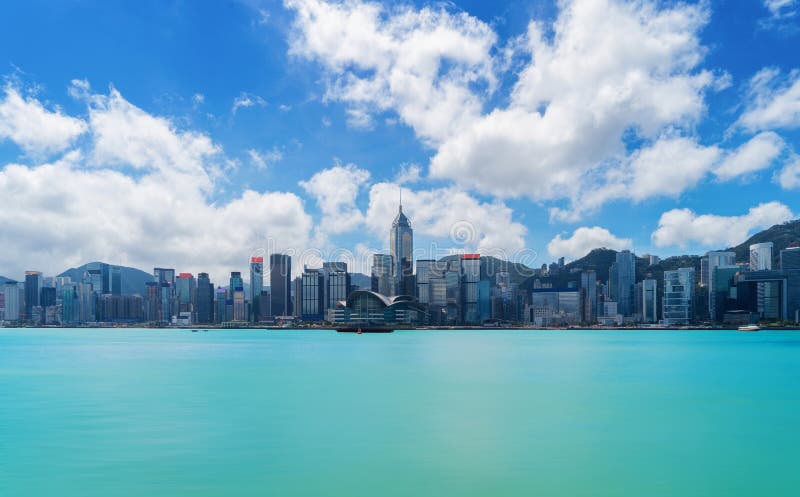 Hong Kong Downtown skyline and Victoria Harbour with blue sky. F