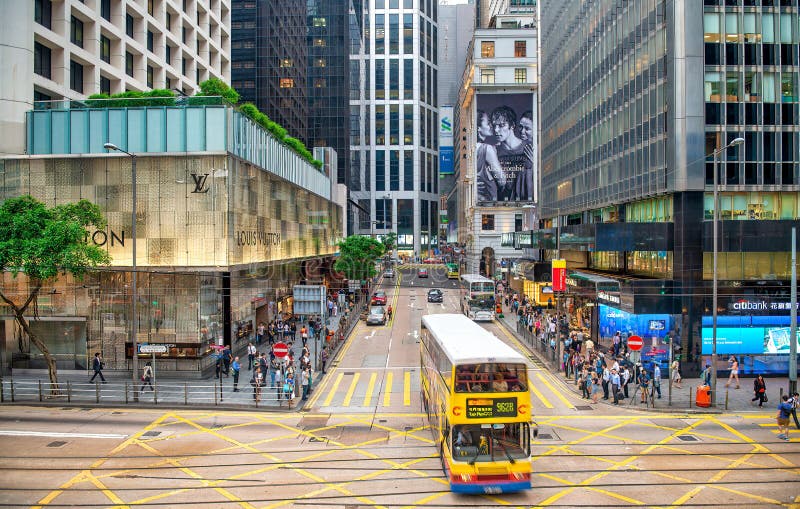 HONG KONG - MAY 12, 2014: City Bus Crosses Downtown Hong Kong Street