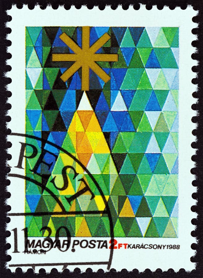 HONGRIE - CIRCA 1988 : Un timbre imprimé en Hongrie dans le numéro de 'Noël' montre l'arbre de Noël, vers 1988 photographie stock HONGRIE - CIRCA 1988 : Un timbre imprimé en Hongrie dans le numéro de 'Noël' montre l'arbre de Noël, vers 1988 photographie stock
