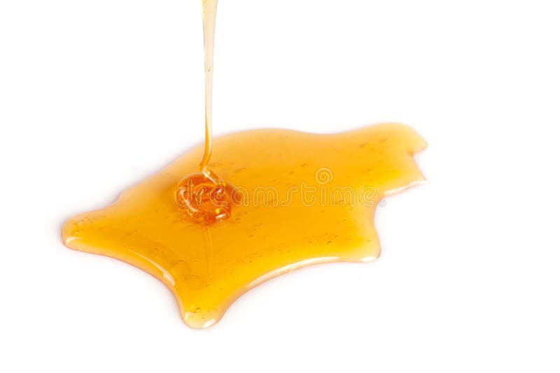 Honigfleck lokalisiert auf einem weißen Hintergrund stockbilder Honigfleck lokalisiert auf einem weißen Hintergrund stockbilder