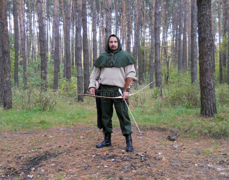 A hooded archer in a wood editorial photo. Image of archer 42707596