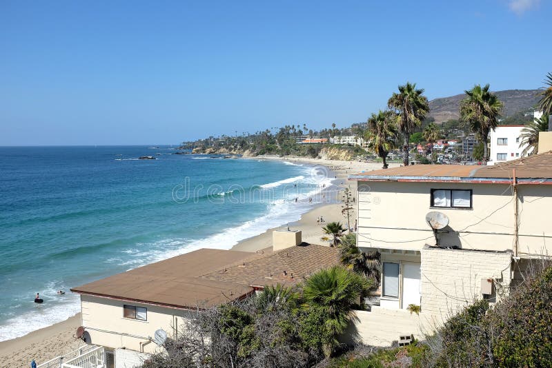 LAGUNA BEACH, CALIFORNIA - OCTOBER 3, 2016: Main Beach. Looking north from Browns Park over homes and businesses. LAGUNA BEACH, CALIFORNIA - OCTOBER 3, 2016: Main Beach. Looking north from Browns Park over homes and businesses.