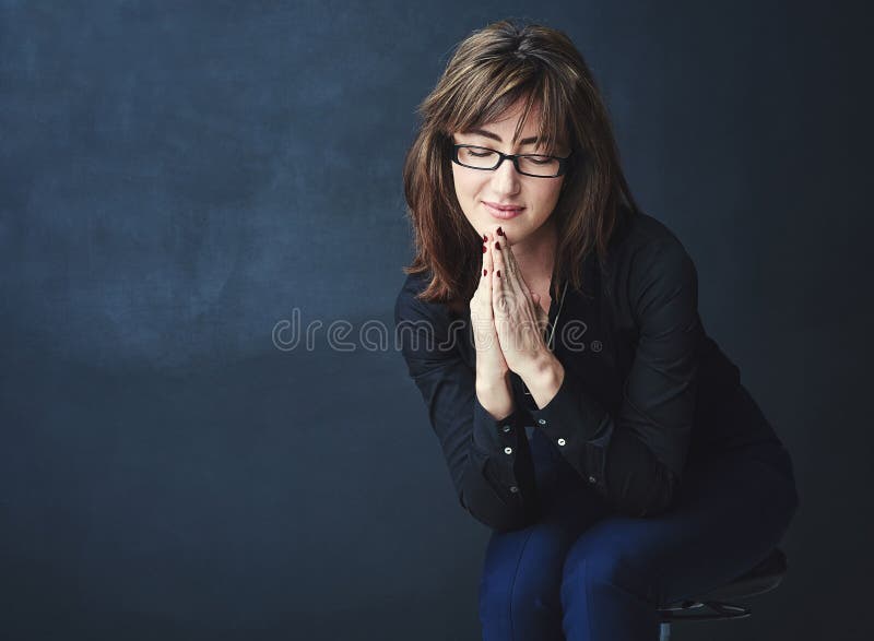 Hope, businesswoman and praying in studio with space for news, promotion results or feedback. Begging, mockup and stock photos