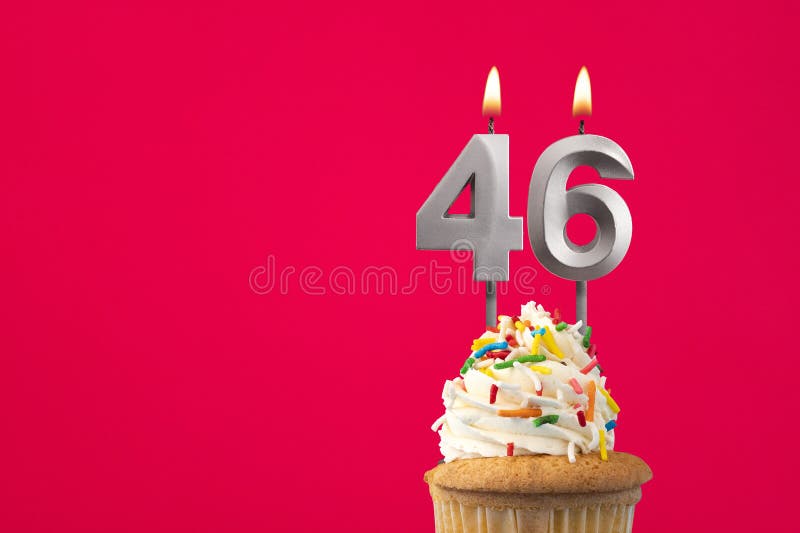Horizontal birthday card with cake - Burning candle number 46 royalty free stock photos