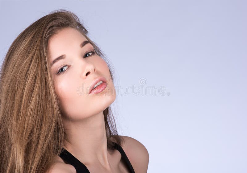 Horizontal closeup portrait of a young woman with long flowing hair stock photography Horizontal closeup portrait of a young woman with long flowing hair stock photography