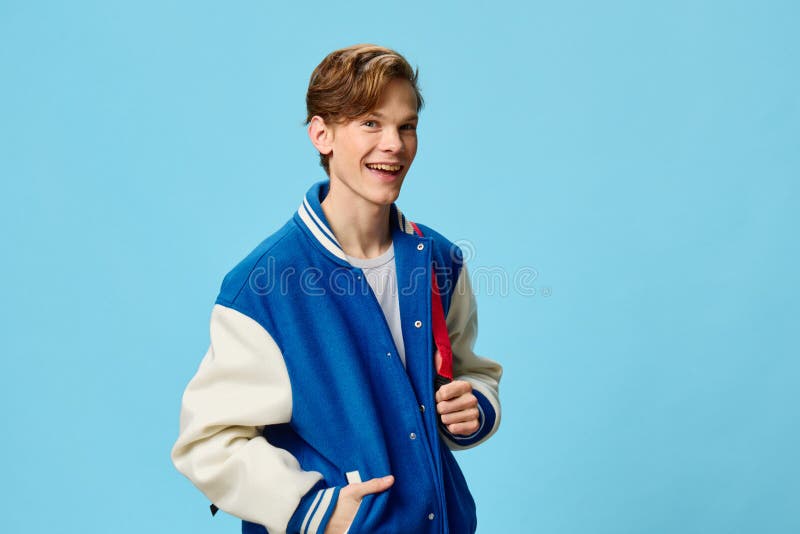 Horizontal Portrait of a Handsome, Joyful Student Guy with a Red