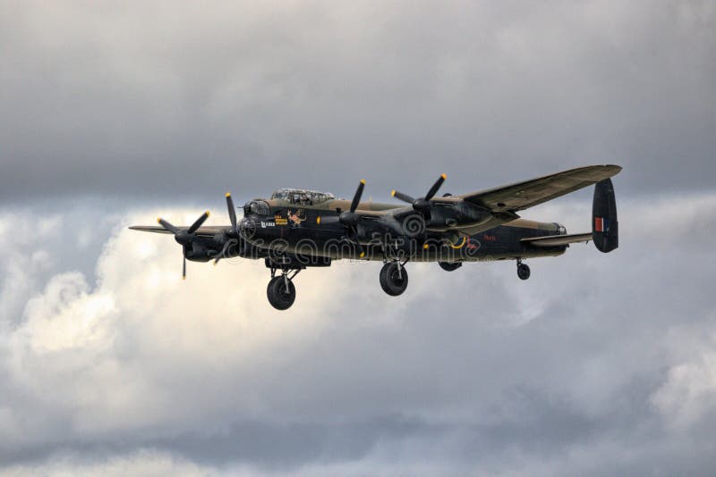 Horizontal shot of Lancaster Aircraft flying over Biggin Hill London on a cloudy day