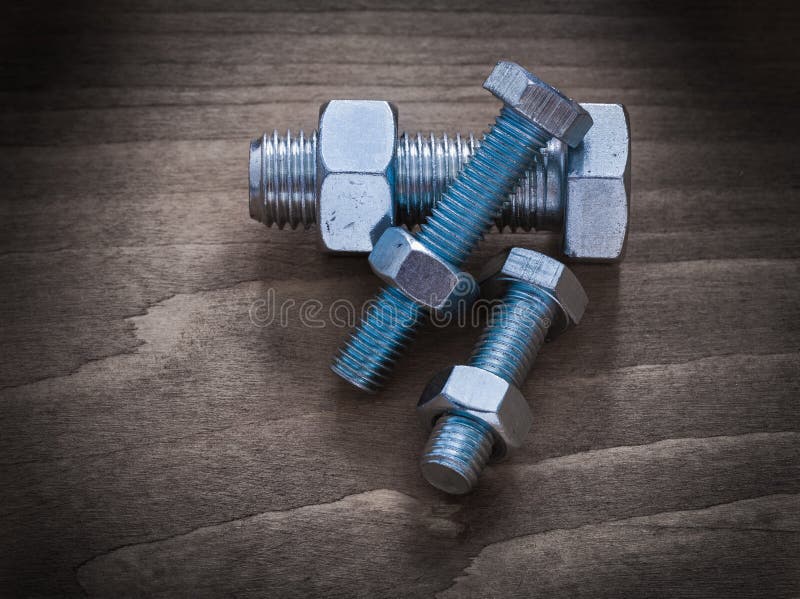 Horizontal Version Of Construction Nuts Bolts On Vintage Wood Bo Stock