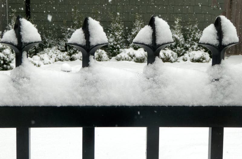 Close-up of vertical and horizontal lines on fencegs provide interesting contrast in this snowy scene royalty free stock photos Close-up of vertical and horizontal lines on fencegs provide interesting contrast in this snowy scene royalty free stock photos