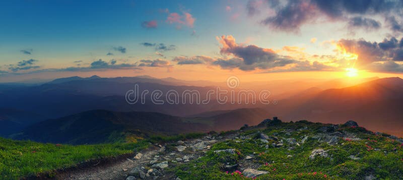 Amazing mountain landscape with colorful vivid sunset on the cloudy sky, natural outdoor travel background. Beauty world. Panoramic view. Amazing mountain landscape with colorful vivid sunset on the cloudy sky, natural outdoor travel background. Beauty world. Panoramic view.