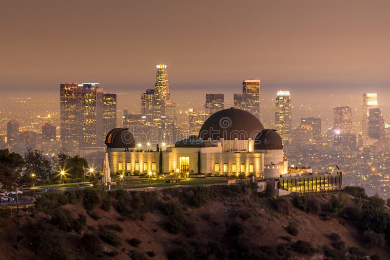 The Griffith Observatory and Los Angeles city skyline at twilight CA. The Griffith Observatory and Los Angeles city skyline at twilight CA