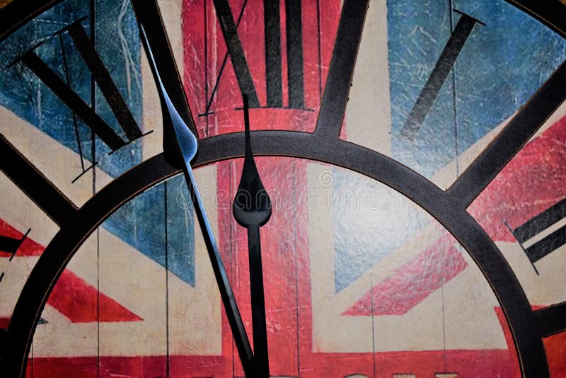 Wall clock with union jack motive as background showing one minute to midnight. Wall clock with union jack motive as background showing one minute to midnight