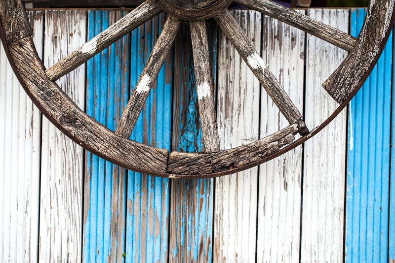 Horse Car Wheel and Wooden Background