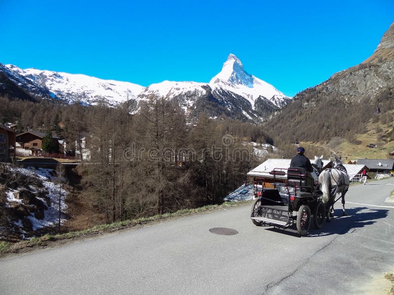Horse carriage and Matterhorn in Zermatt, Switzerland .