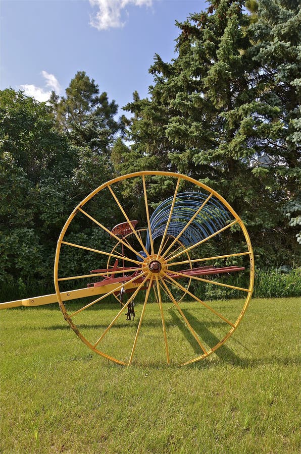 Old Horse Drawn Farm Equipment Lined Up in a Field Stock Photo Image