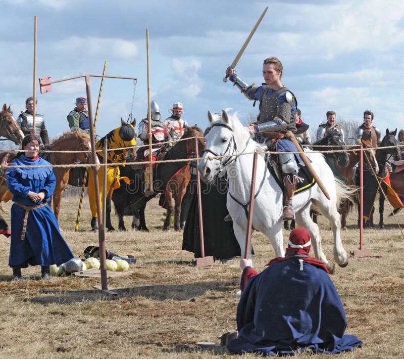The horse knight with a sword in a hand on a white stock photo