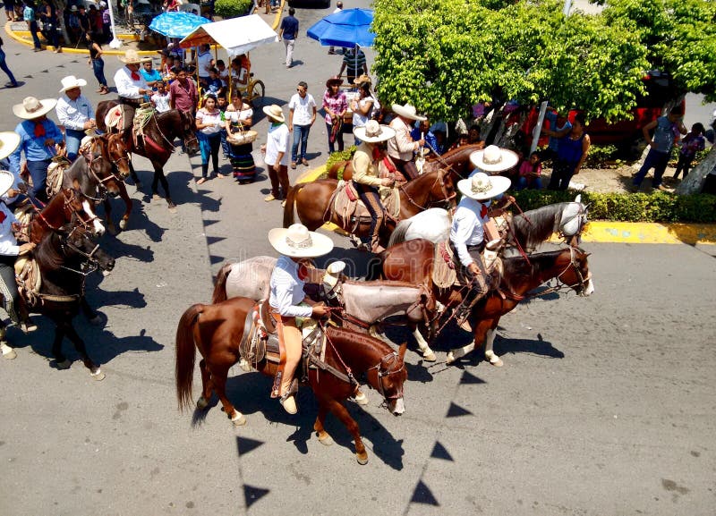 Horse riders with typical charro attire at Enrama de San Isidro Labrador in Comalcalco Tabasco Mexico.