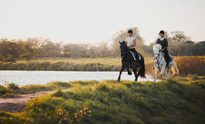 Horse riding, freedom and equestrian with friends in nature on horseback by the lake during a summer morning