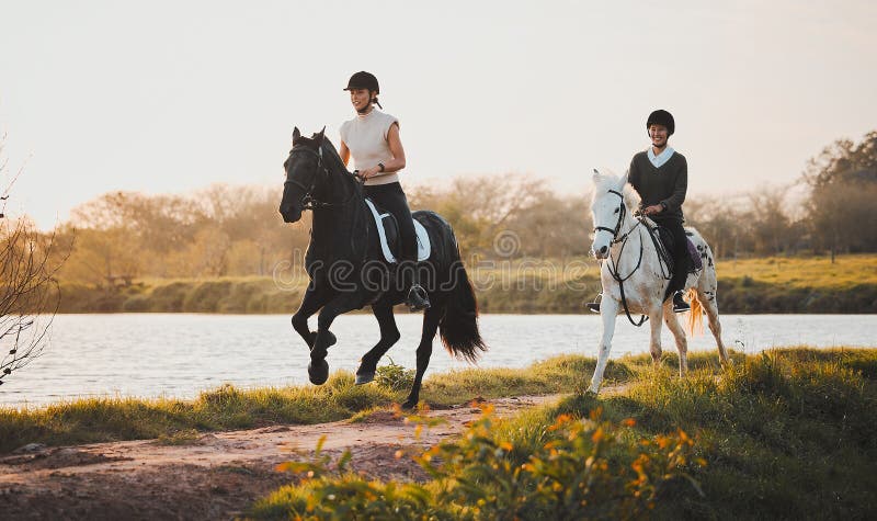 Horse riding, freedom and hobby with friends in nature on horseback by the lake during a summer morning. Countryside