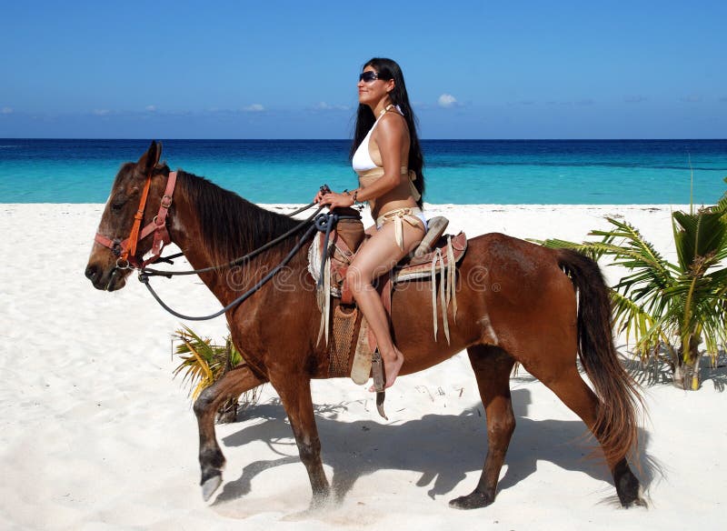Horseback Riding On A Beach