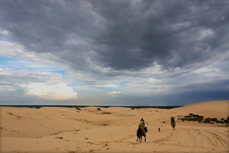 Horseback riding in desert