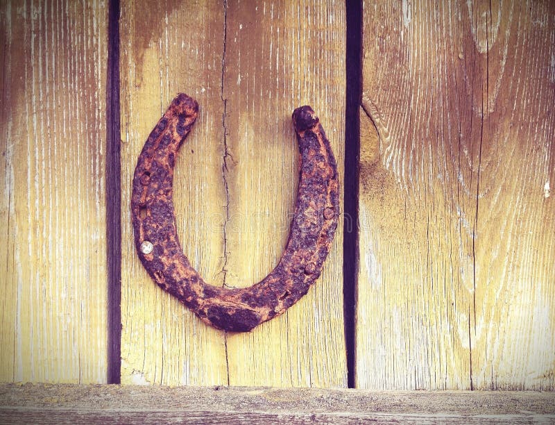 An Old Horseshoe On A Red Wall Stock Photo Image of antique, cowboy