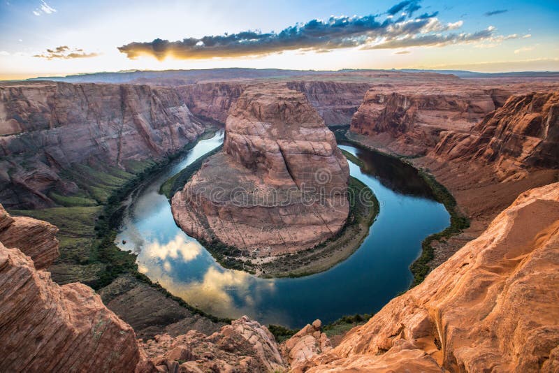 Known as Horseshoe Bend, the Colorado River winds into a horseshoe, carving a path into the sandy red southwest desert of northern Arizona, near Page, aiding the erosion of the canyon walls, considered by some to be part of the Grand Canyon, although not part of the national park. Known as Horseshoe Bend, the Colorado River winds into a horseshoe, carving a path into the sandy red southwest desert of northern Arizona, near Page, aiding the erosion of the canyon walls, considered by some to be part of the Grand Canyon, although not part of the national park.