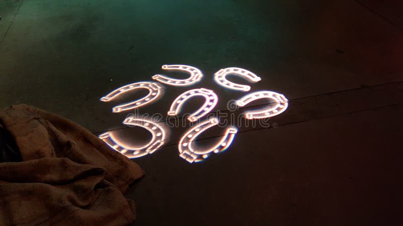 Horseshoes Featured on Concrete Floor from Projected Light Stock Image