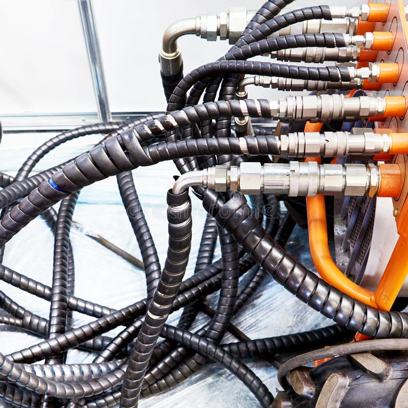 Hoses of hydraulic machine stock image. Image of steel 249124939