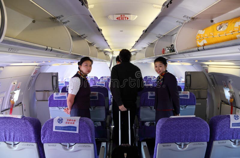 Hospedeiros de bordo da linha aérea de China fotos de stock Hospedeiros de bordo da linha aérea de China fotos de stock