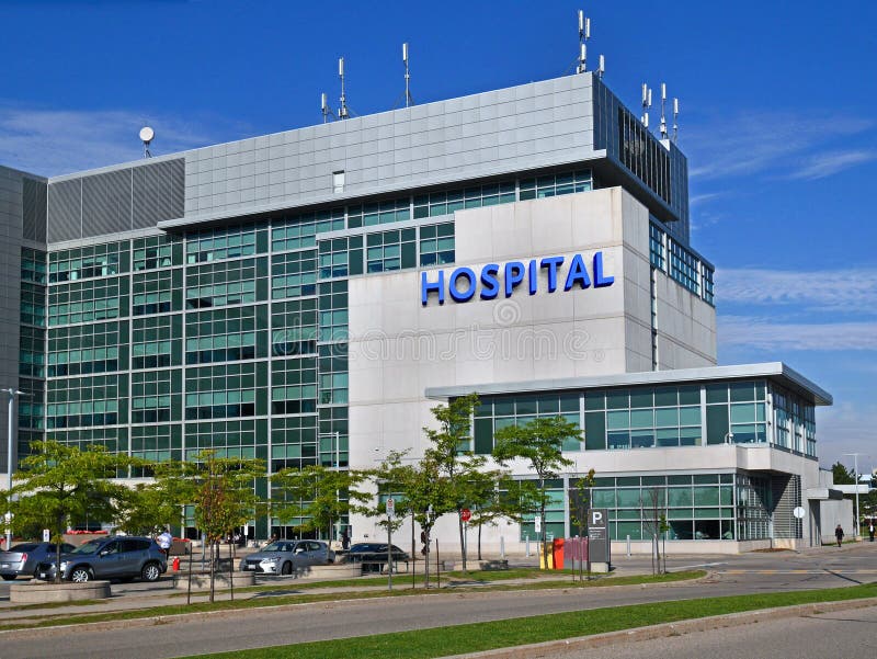 Modern hospital building and parking lot. Modern hospital building and parking lot