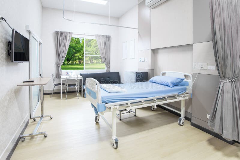 Hospital Room with Beds and Comfortable Medical Equipped in a Mo Stock