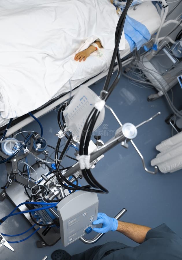 Hospital Room with Electronic Equipment Around the Patient Bed Stock