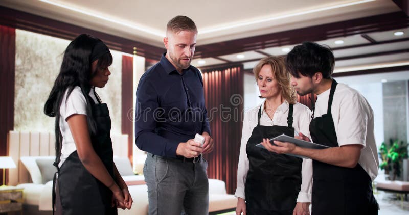 Hospitality Manager Demonstrating HVAC And Remote Control royalty free stock photos