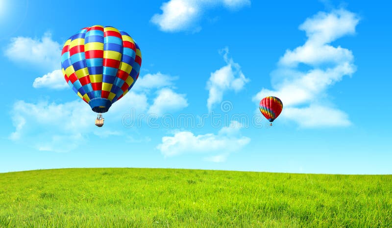 Hot Air Balloon Floating in the Sky Over the Green Field Stock Image ...