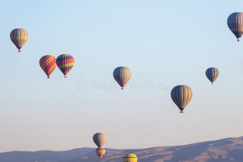 Hot air balloon in sky at sunrise in Goreme Cappadocia