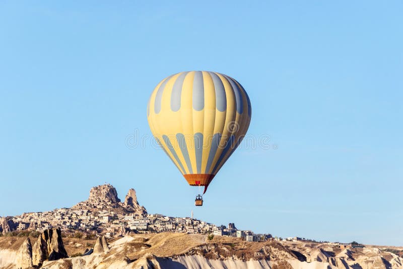 Hot air balloon in sky at sunrise in Goreme Cappadocia