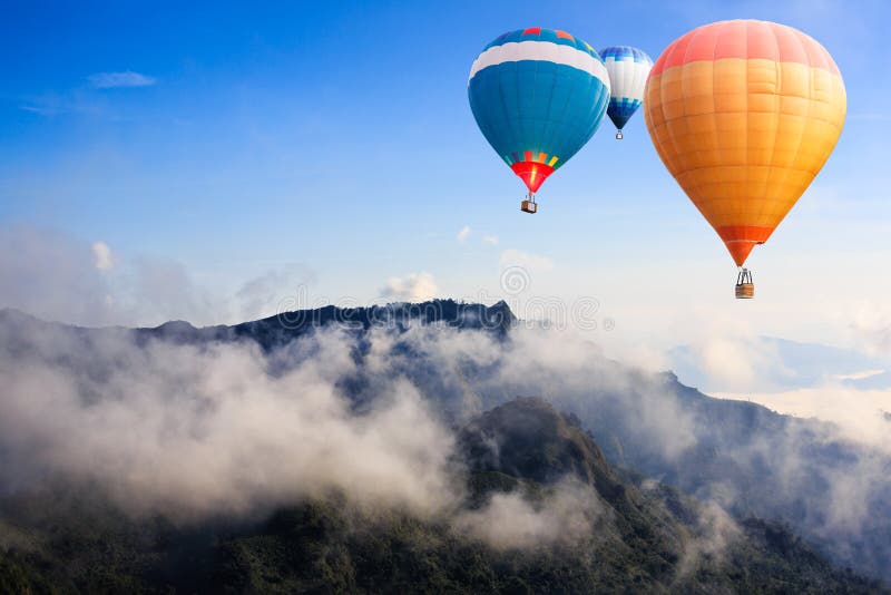 Hot-air balloons flying over the mountain