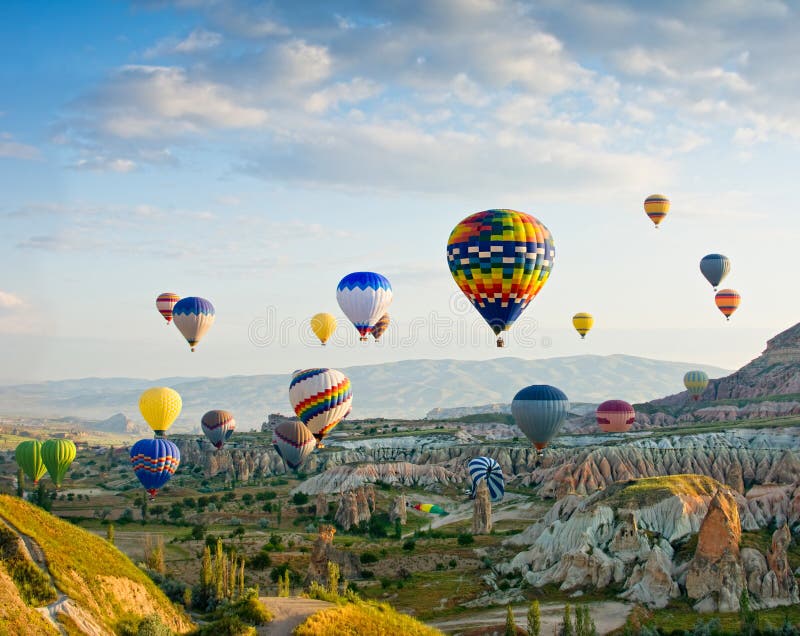 Hot air balloons flying over Red valley at Cappadocia, Turkey stock photos Hot air balloons flying over Red valley at Cappadocia, Turkey stock photos