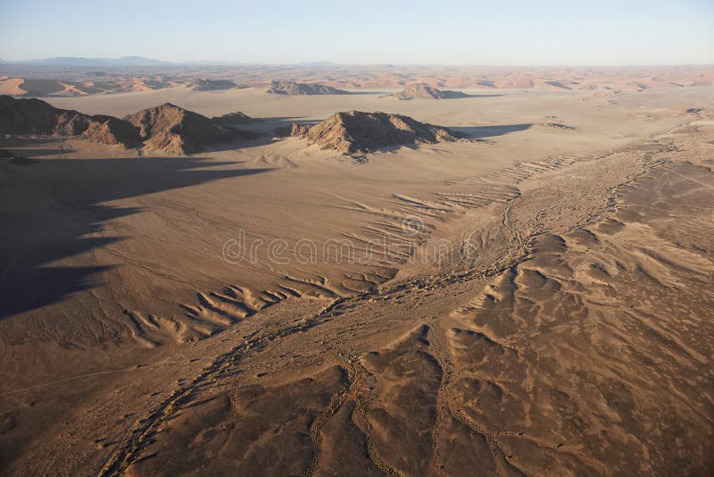 Hot air balloons landing on the sands of the Sossusvlei Desert, stock photo Hot air balloons landing on the sands of the Sossusvlei Desert, stock photo