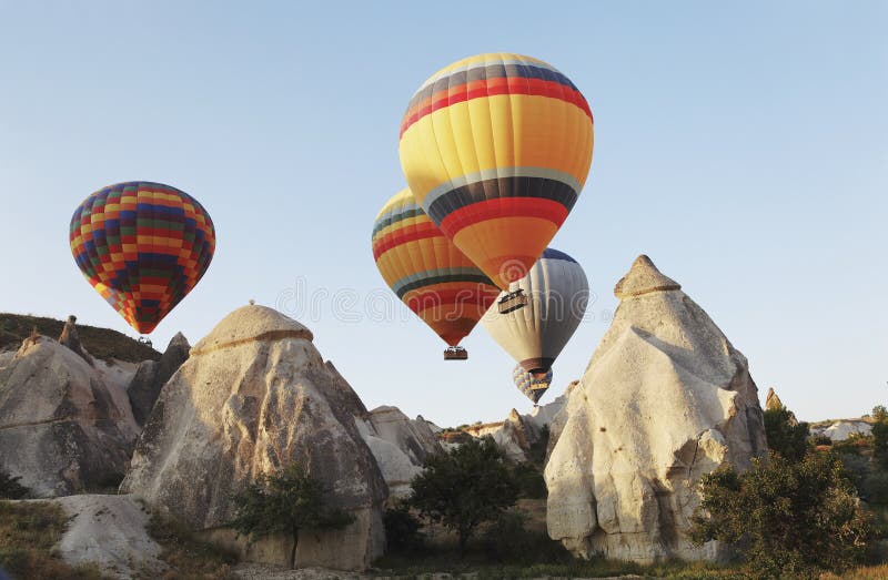 Hot air balloons over Cappodocia terrain