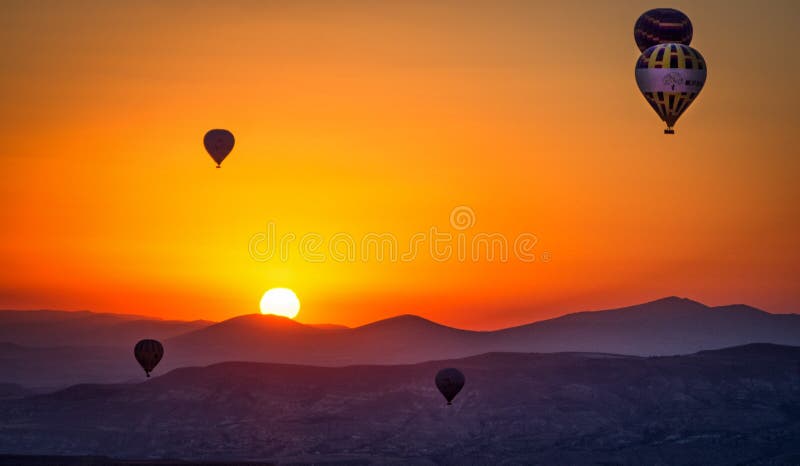 Hot air balloons at sunrise in cappadoccia