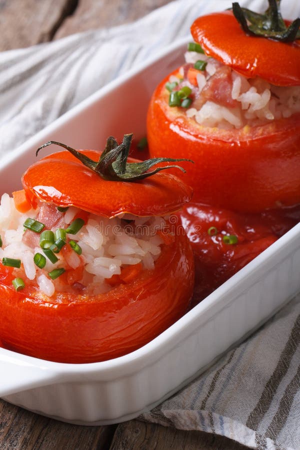 Hot Appetizer of Baked Tomatoes Filled with Rice, Vegetables Stock