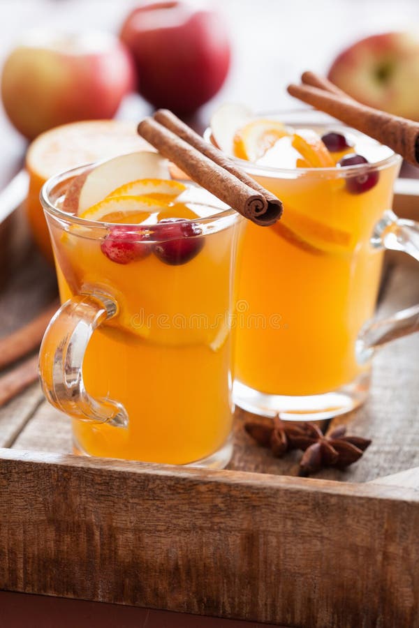 Hot Apple Orange Cider with Cinnamon Spice Warming Drink Stock Photo