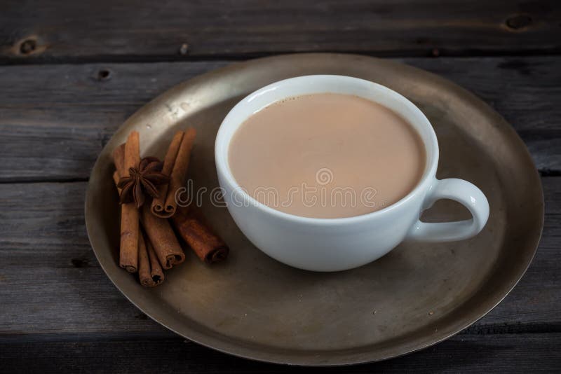 Hot beverage in cup and spices. Style rustic. Copy space. Selective focus. Traditional big metal pot stock images, royalty-free photos and pictures